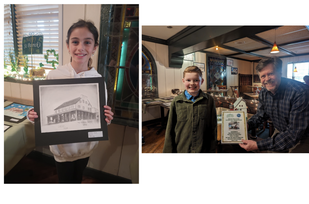 Student with art work in their hand on the left and on the right of the photo is a student with a certificate and gentleman to the right of him 